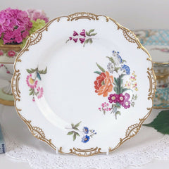 An antique Minton dessert/cabinet plate decorated with handpainted flowers