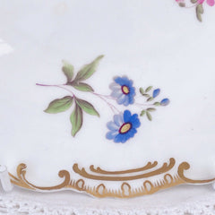 An antique Minton dessert/cabinet plate decorated with handpainted flowers