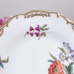 An antique Minton dessert/cabinet plate decorated with handpainted flowers