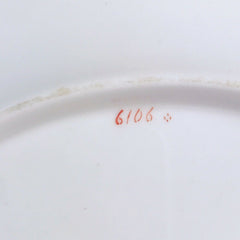An antique Minton dessert/cabinet plate decorated with handpainted flowers