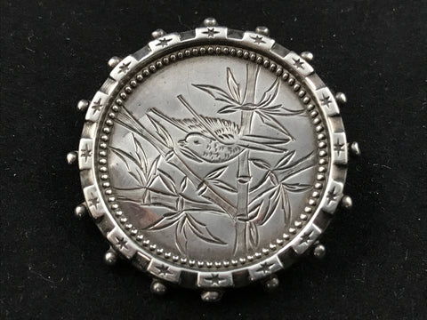 Victorian silver Aesthetic Movement brooch engraved with a bird in bamboo