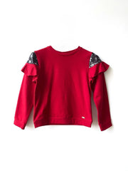 Maglia con paillettes e volant