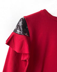 Maglia con paillettes e volant