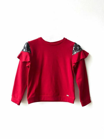 Maglia con paillettes e volant