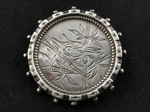 Victorian silver Aesthetic Movement brooch engraved with a bird in bamboo